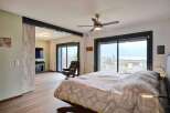 Luxurious bedroom with stunning lake views.