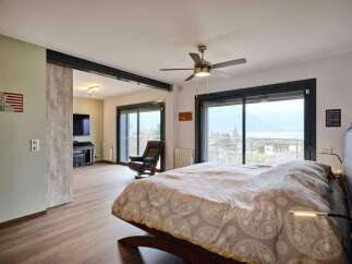 Luxurious bedroom with stunning lake views.