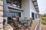 This stunning property boasts a spacious deck with breathtaking views, perfect for outdoor entertaining.