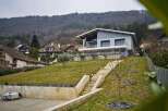 Stunning contemporary home nestled on a hillside, offering breathtaking views.