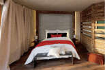 Experience rustic elegance in this cozy bedroom.