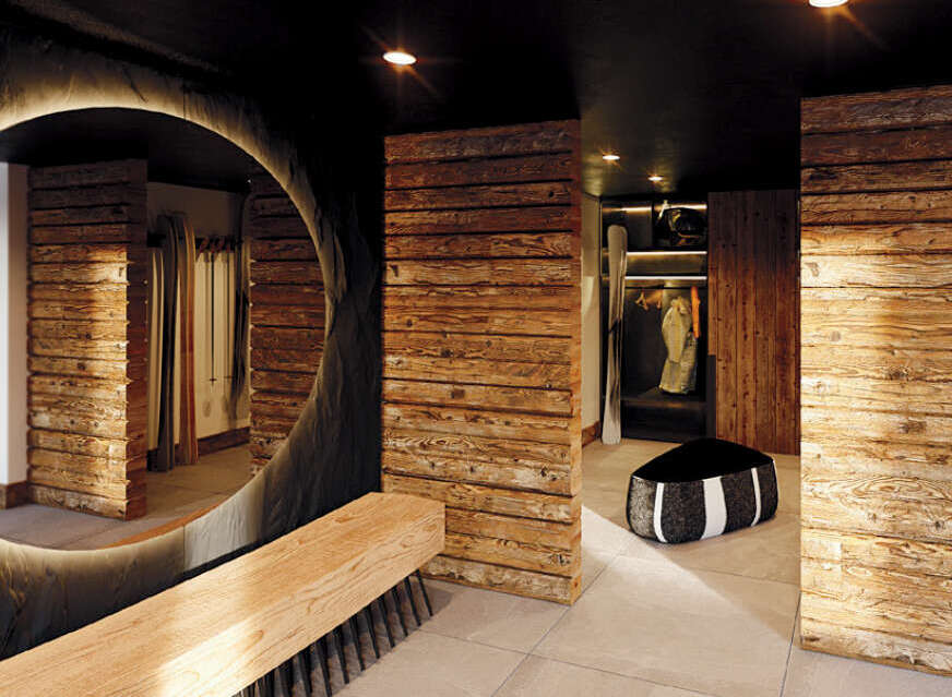 This luxurious property boasts a stunning interior design with rustic wooden accents throughout.