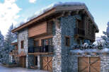 This stunning chalet boasts a beautiful stone exterior and a charming wooden facade.