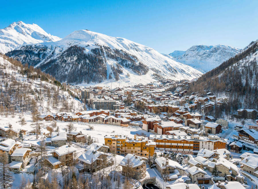 Experience the charm of a snow-covered village nestled in the heart of the Alps.