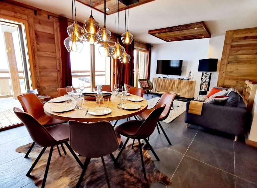 Experience luxury living in this stunning property, featuring a beautifully designed dining area perfect for entertaining.
