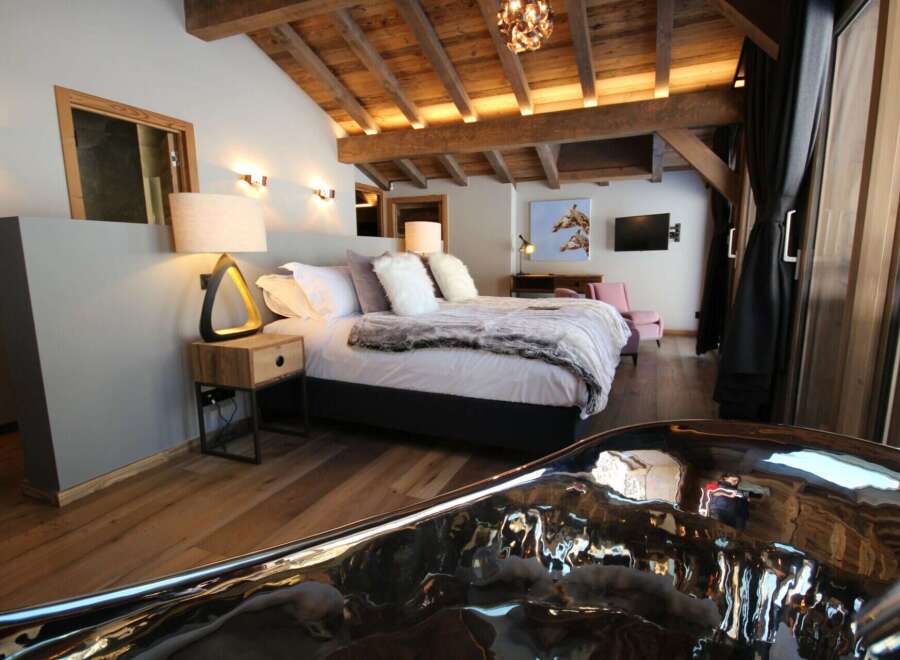 Experience luxury in this stunning bedroom featuring a unique, modern design.