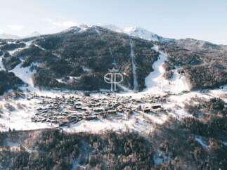 Discover a stunning mountain property nestled in a picturesque winter wonderland.