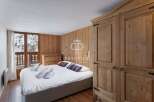 Discover a cozy bedroom retreat with rustic wooden accents.