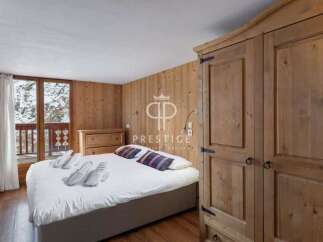 Discover a cozy bedroom retreat with rustic wooden accents.