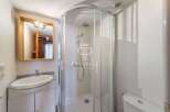 Discover a modern bathroom with a sleek shower enclosure.