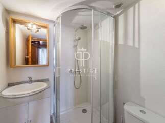 Discover a modern bathroom with a sleek shower enclosure.