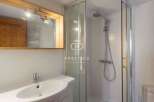 Discover a modern bathroom with a sleek shower and a stylish sink.