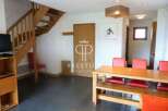Discover this charming property featuring a cozy wooden staircase and a spacious dining area.