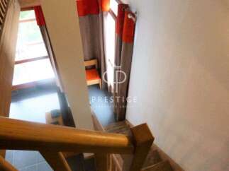 Discover a stunning property featuring a beautifully designed staircase.