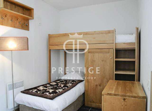 Discover a cozy bedroom featuring a unique bunk bed design, perfect for maximizing space.