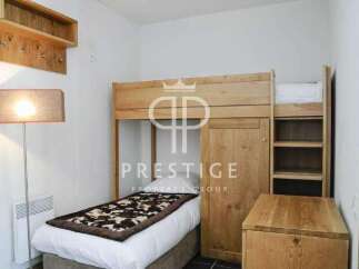 Discover a cozy bedroom featuring a unique bunk bed design, perfect for maximizing space.