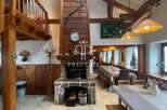 Discover the charm of this property, featuring a cozy fireplace and rustic wooden accents.