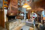 Discover the charm of this stunning property, featuring a cozy fireplace and exposed wooden beams that exude warmth and character.