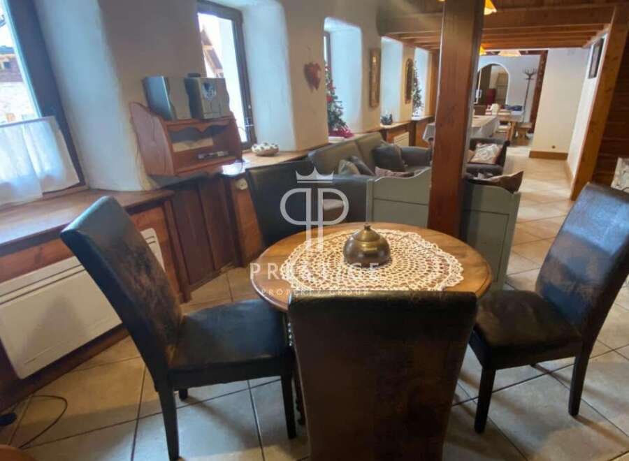 Discover the charm of this property, featuring a cozy dining area perfect for intimate gatherings.