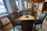 Discover the charm of this property, featuring a cozy dining area perfect for intimate gatherings.