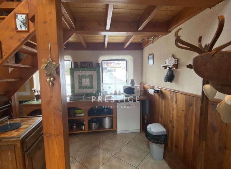 Charming rustic kitchen with wooden accents and a cozy atmosphere.