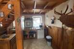 Charming rustic kitchen with wooden accents and a cozy atmosphere.