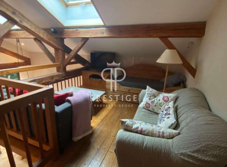 Discover the charm of this unique property featuring exposed wooden beams and a cozy loft space.