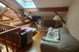 Discover the charm of this unique property featuring exposed wooden beams and a cozy loft space.