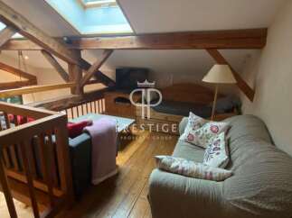 Discover the charm of this unique property featuring exposed wooden beams and a cozy loft space.