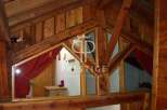 Discover the charm of this unique property, featuring stunning wooden architecture and a cozy, inviting atmosphere.