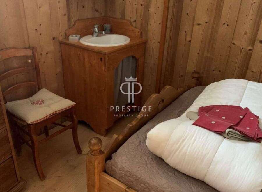 Charming rustic bedroom with wooden accents.