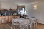 Discover a stunning property featuring a modern kitchen with wooden cabinets and a sleek countertop.