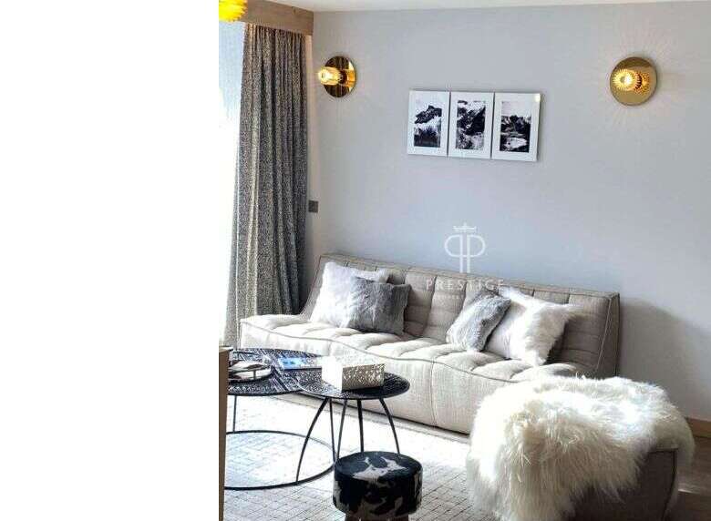 Discover a stylish living space with a modern sofa and elegant wall art.