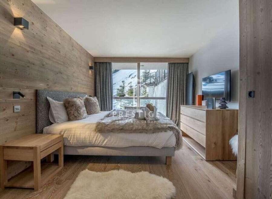 Experience luxury in this stunning bedroom with a cozy ambiance.