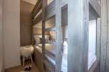 Discover the charm of this cozy bedroom featuring a unique bunk bed design.