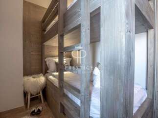 Discover the charm of this cozy bedroom featuring a unique bunk bed design.