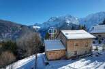 Discover a stunning mountain chalet nestled in a picturesque winter wonderland.