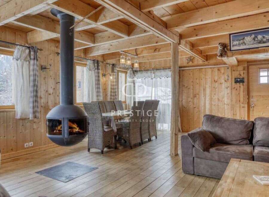 Experience the warmth of this stunning cabin with its inviting fireplace and rustic wooden interior.