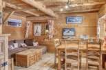 Experience the charm of this cozy wooden cabin, perfect for a relaxing getaway.