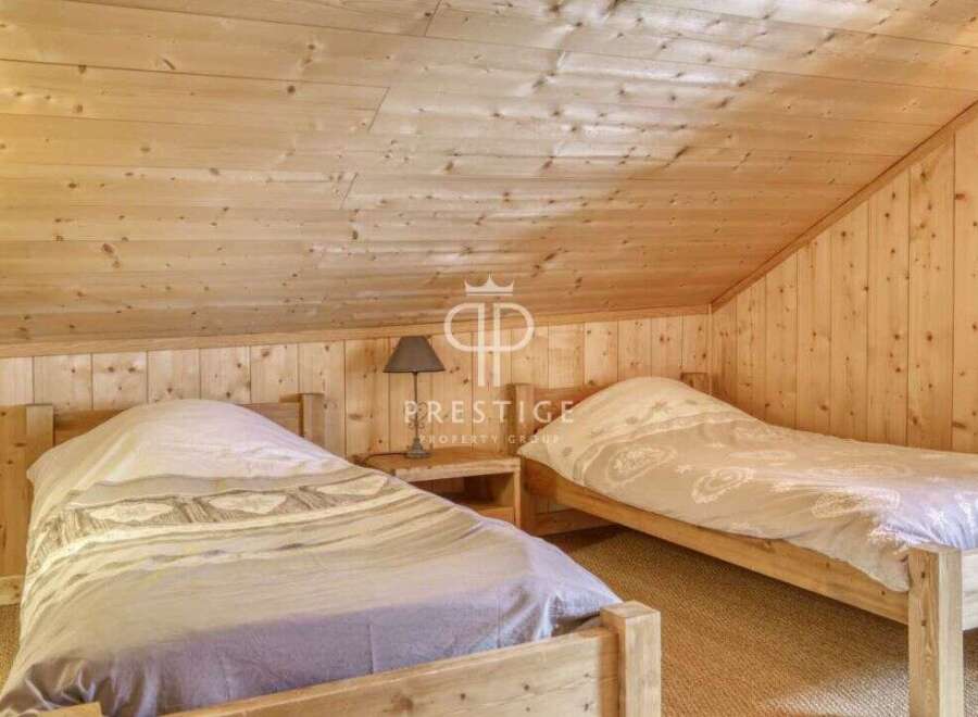 Discover the charm of this cozy bedroom, featuring rustic wooden accents that create a warm and inviting atmosphere.