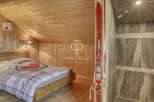 Discover the charm of this cozy mountain retreat! Featuring a rustic wooden interior, this property offers a warm and inviting atmosphere.