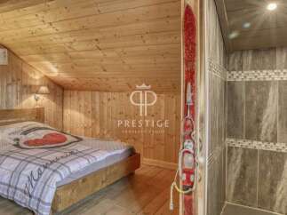 Discover the charm of this cozy mountain retreat! Featuring a rustic wooden interior, this property offers a warm and inviting atmosphere.