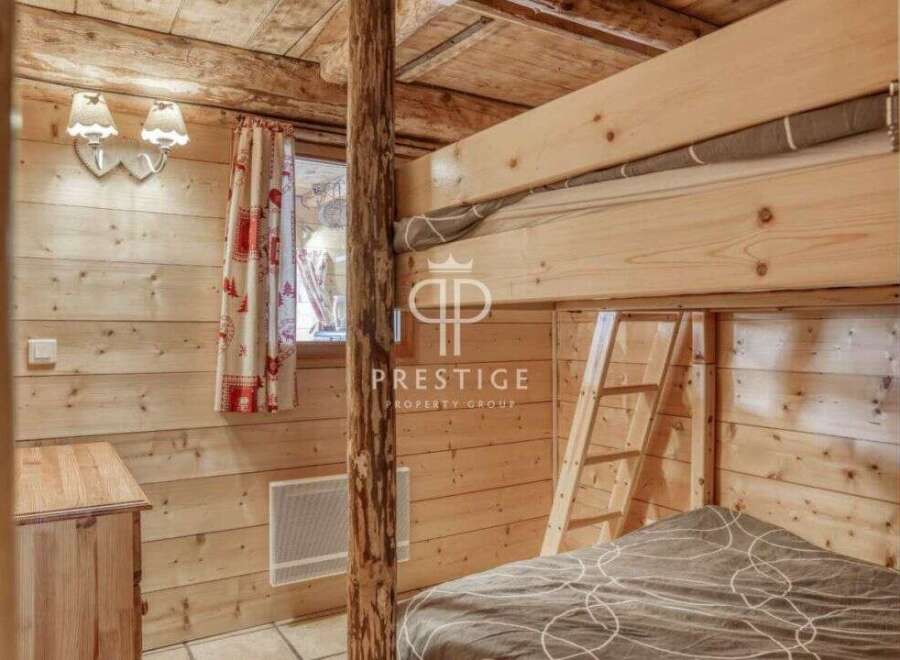 Discover the charm of this cozy cabin with its rustic wooden interior.