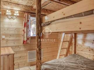 Discover the charm of this cozy cabin with its rustic wooden interior.