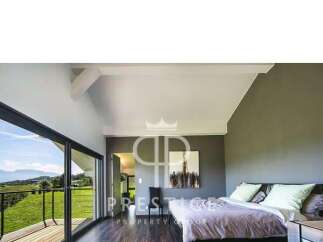 Experience luxury living in this stunning bedroom with breathtaking views.