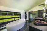 Indulge in luxury within this stunning bathroom, featuring a sleek, modern design.
