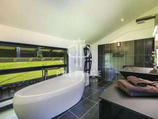 Indulge in luxury within this stunning bathroom, featuring a sleek, modern design.