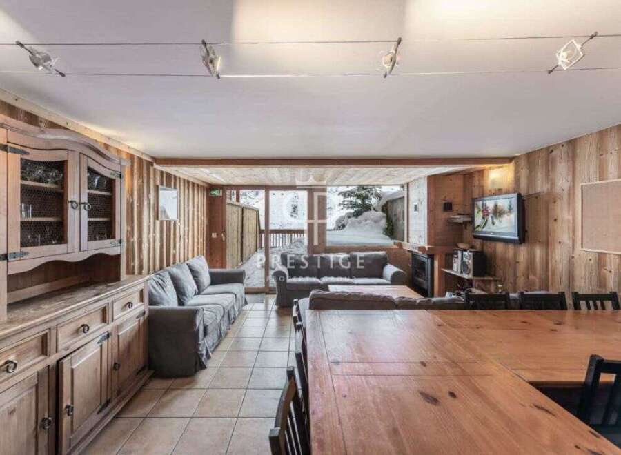 Experience the charm of this cozy chalet, featuring warm wooden interiors and a spacious layout.