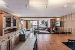 Experience the charm of this cozy chalet, featuring warm wooden interiors and a spacious layout.