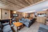 Experience rustic charm in this stunning property, featuring warm wooden interiors and a cozy fireplace.
